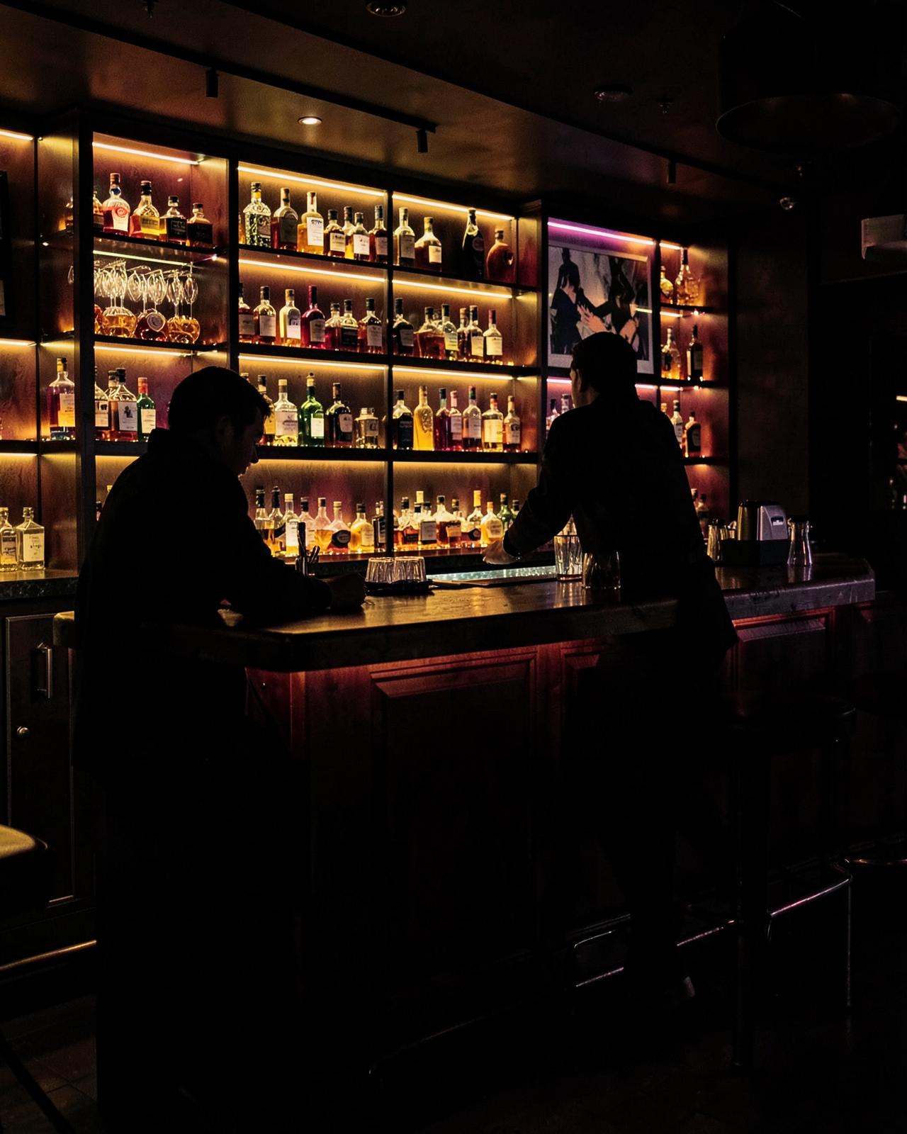 The lit bar shelves at Club Pave